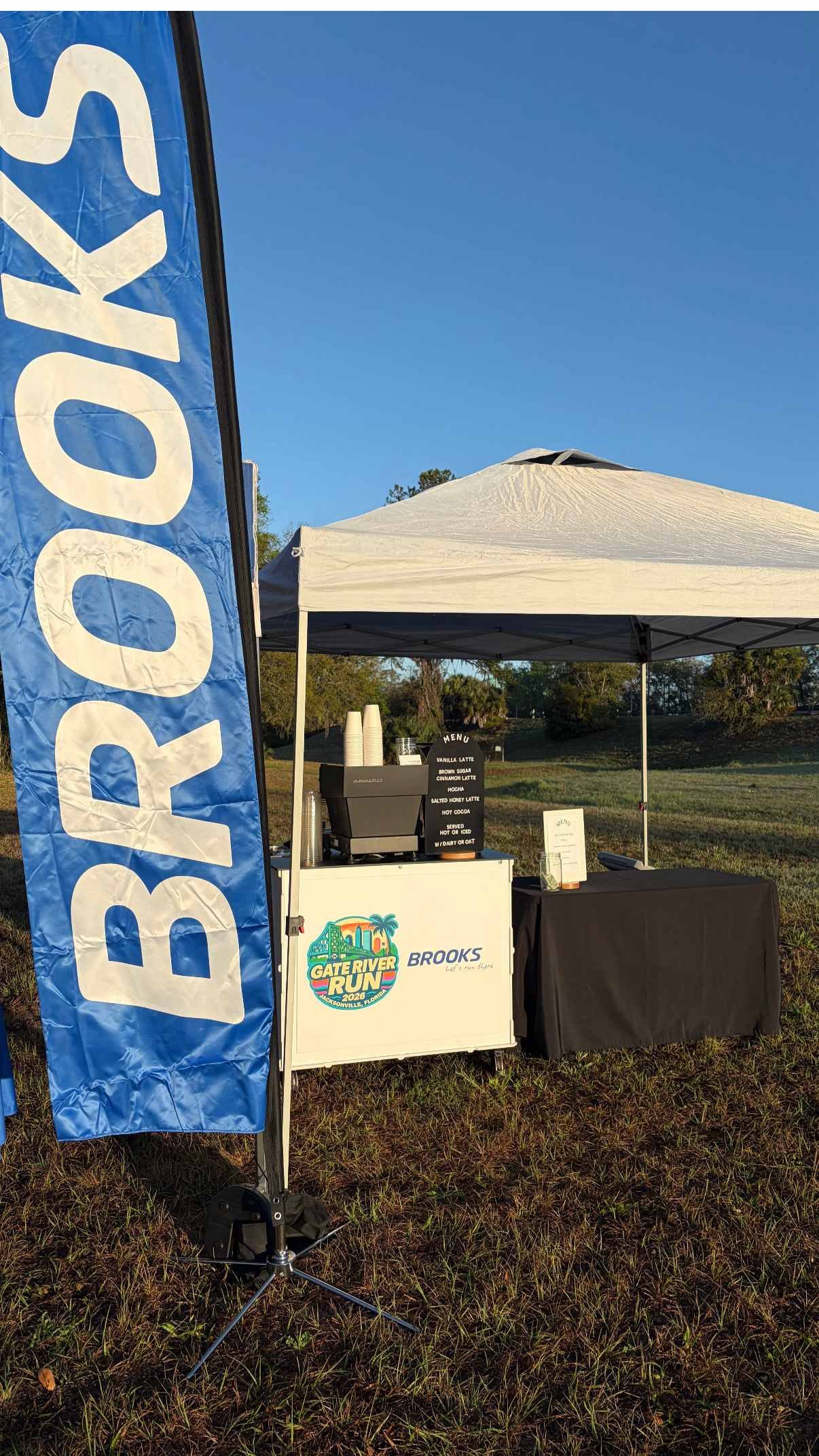 Break Coffee Cart mobile espresso setup with Brooks branding at the Gate River Run brand activation in Jacksonville
