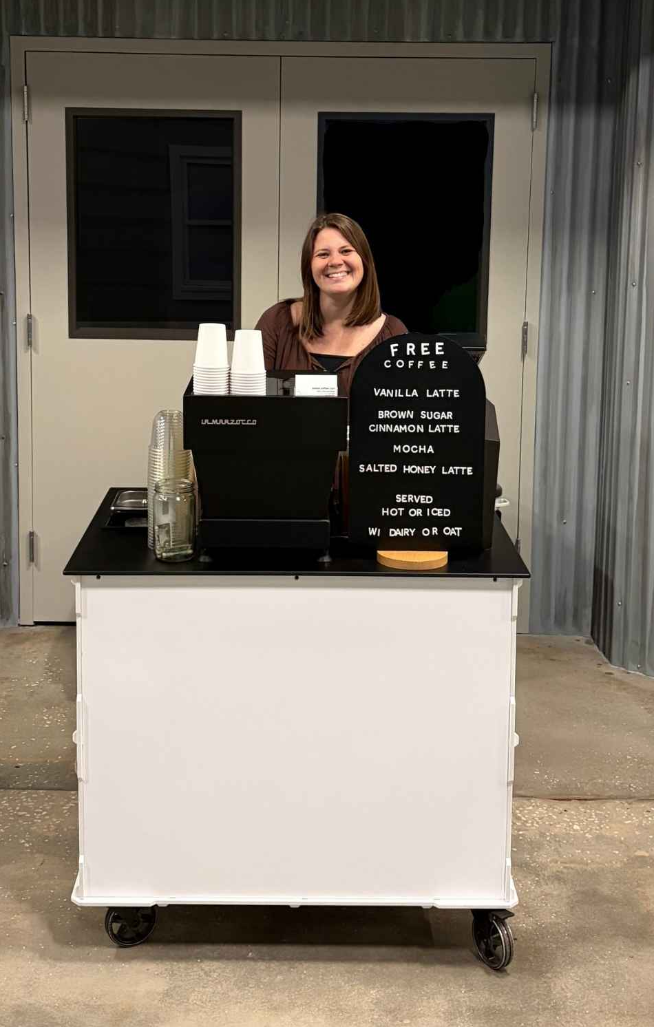 Sarah serving craft espresso from the Break Coffee Cart mobile bar